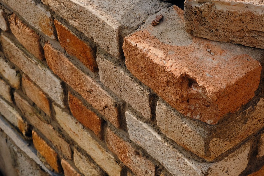 Close-up of red, orange, and tan brick wall