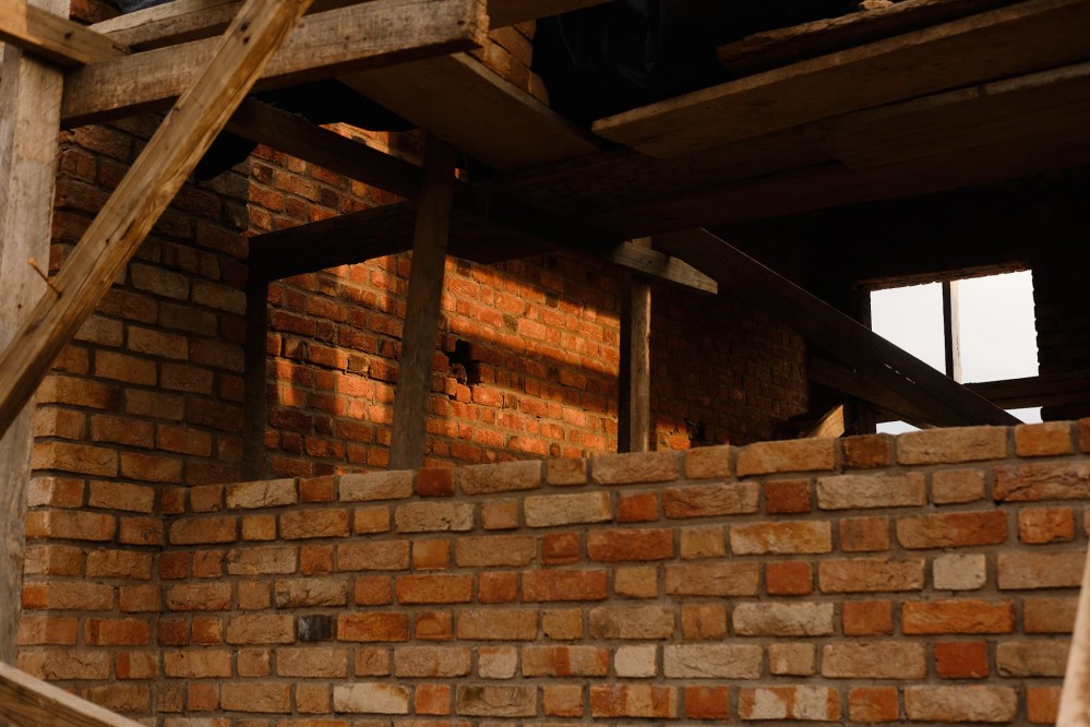 Evening light on a brick building under construction