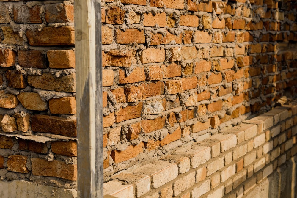 A brick wall under construction