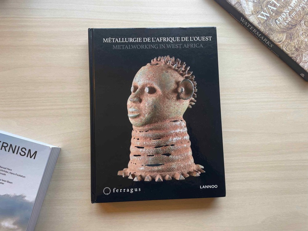 A hardcover book on a table, titled