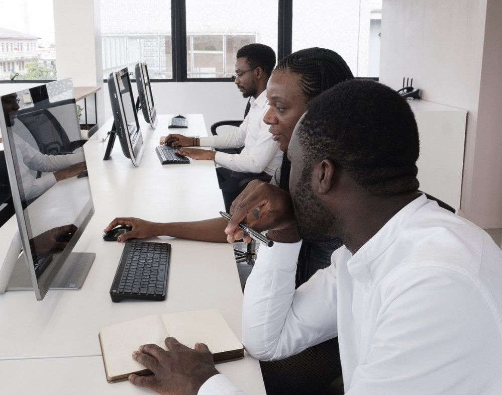 Members of the Studio Contra team working at their computers